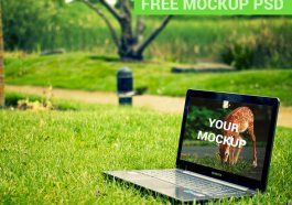 laptop on green grass mockup psd notebook