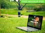 laptop on green grass mockup psd notebook